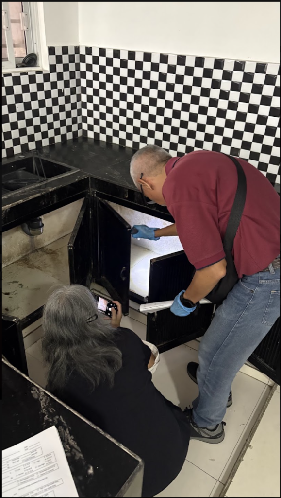 Property inspector checking house plumbing in Metro Manila